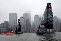 AC45F racing sailboats Oracle Team USA (L) and Land Rover BAR (R) sail past lower Manhattan during practice racing ahead of the America's Cup World Series sailing event in New York, May 6, 2016. REUTERS/Mike Segar