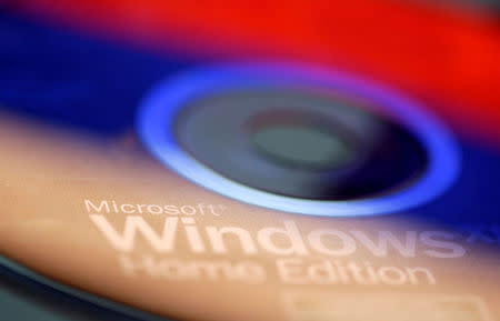 FILE PHOTO: Russian flag are reflected on the Microsoft Windows Installation CD in this illustration taken January 12, 2018. Picture taken January 12, 2018. REUTERS/Dado Ruvic