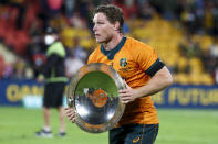 Australia's Michael Hooper holds the Nelson Mandela Plate after defeating South Africa in the Rugby Championship test match between the Springboks and the Wallabies in Brisbane, Australia, Saturday, Sept. 18, 2021. (AP Photo/Tertius Pickard)