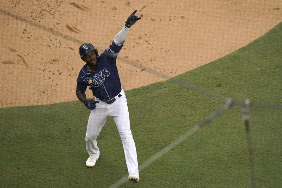 Tampa Bay Rays' Randy Arozarena reacts after crossing the plate after hitting a solo home run during the first inning in Game 2 of a baseball American League Division Series against the New York Yankees, Tuesday, Oct. 6, 2020, in San Diego. (AP Photo/Gregory Bull)