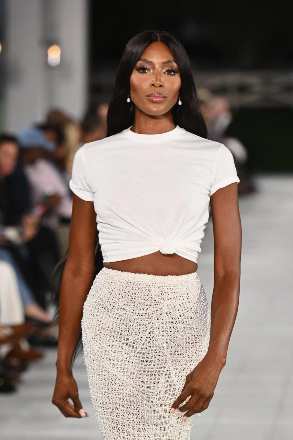 Campbell flashes toned abs as she hit the runway at show attended by Anna Wintour amid feud (AFP via Getty Images)