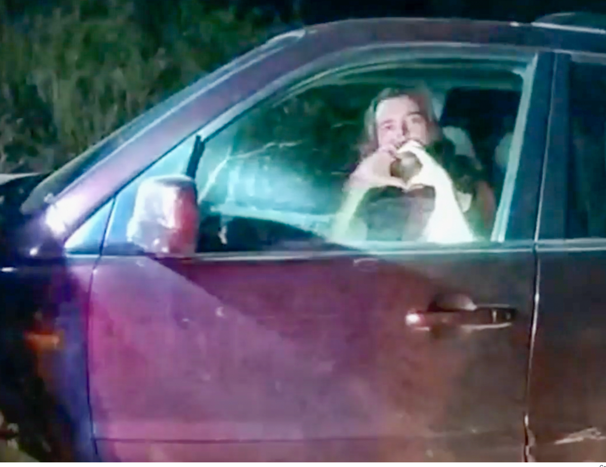 Christian Glass making heart signs to police on the night he was killed (CCSO)