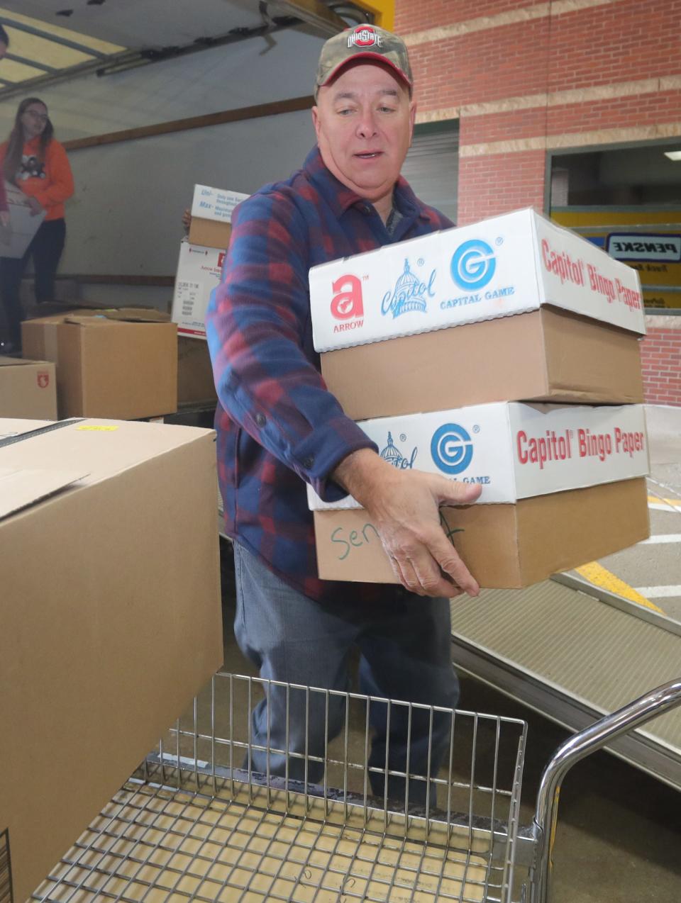 Curt Mayle, a member of the Children's Toy Fund Bingo, unloads a truck with 3,715 toys for patients at Akron Children's Hospital on Tuesday, Dec. 13, 2022 in Akron.