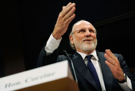 Former MF Global CEO Jon Corzine gestures as he testifies before a House Financial Services Committee Oversight and Investigations Subcommittee hearing on the collapse of MF Global, at the U.S. Capitol in Washington, in this file photo from December 15, 2011. REUTERS/Jonathan Ernst/Files