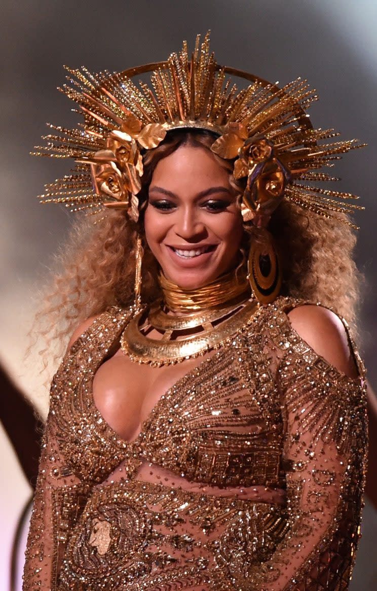 <i>Beyonce transformed into a golden goddess at the 2017 Grammys [Photo: Rex]</i>