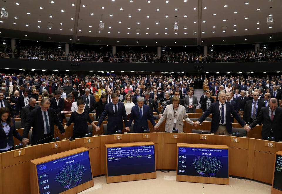 Members of the European Parliament react after voting on the Brexit deal during a plenary session at the European Parliament in Brussels, Belgium January 29, 2020.  REUTERS/Yves Herman/Pool