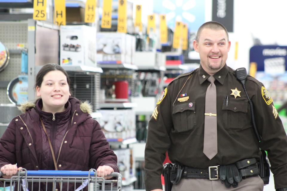 The goal of the Shop with a Hero event is to brighten some children's holidays, as well as giving them time to get to know a first responder, such as Lt. Josh Ginop of the Cheboygan County Sheriff's Department, while shopping for gifts for friends and family. 