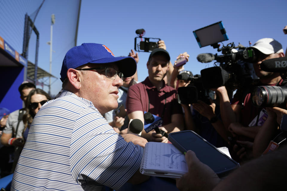 FILE - New York Mets owner Steve Cohen talks to the media during spring training baseball practice Monday, Feb. 20, 2023, in Port St. Lucie, Fla. As New York Mets owner Steve Cohen dominated an offseason that saw billions spent, the sport braced for a new world that includes pitch clocks, limits on defensive shifts and larger bases, an attempt to reverse decades of lengthening games and the Analytics Era domination of the Three True Outcomes.(AP Photo/Jeff Roberson, File)