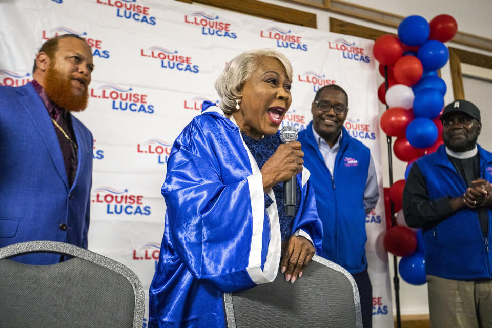 Donning a boxing robe, Sen. Louise Lucas celebrates her win for Virginia's 18th District State Senate Democratic nomination at Bide-A-Wee golf course in Portsmouth, Va., on Tuesday, June 20, 2023. (Kendall Warner/The Virginian-Pilot via AP)