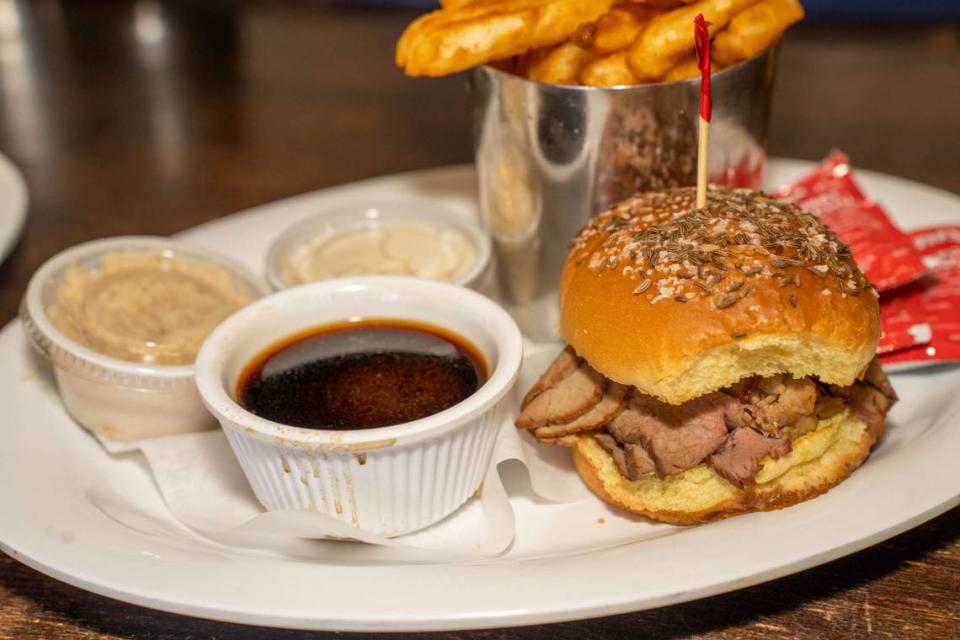 Lebowsi’s Beef on Weck has roast beef and provolone, grilled panini-style, and comes with au jus and horsey sauce. (The weck is a kaiser roll with kosher salt and caraway seeds baked on top.)