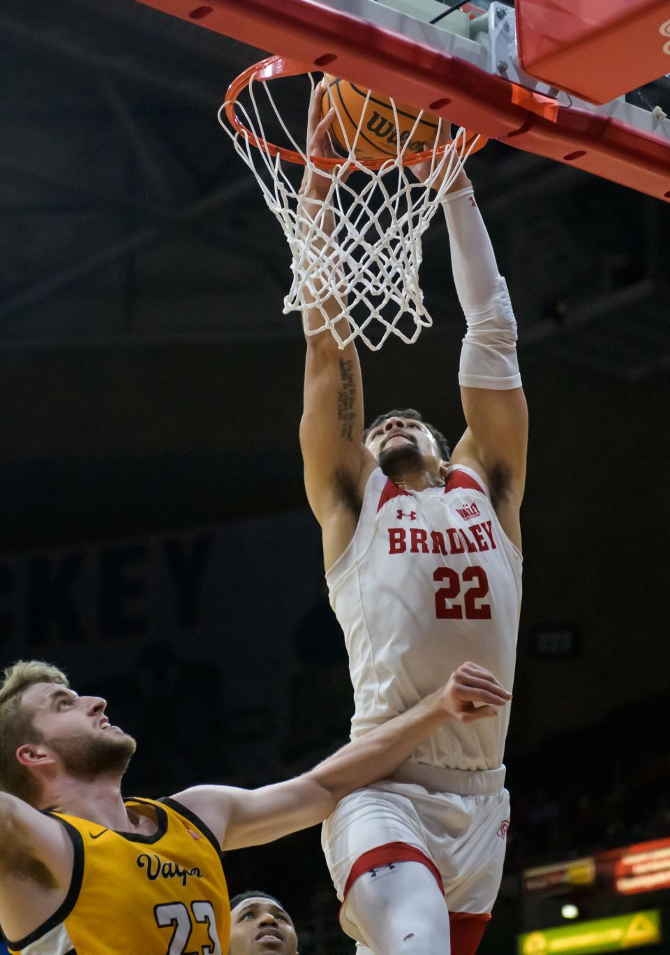 Bradley's Ja'Shon Henry (22) dunks over Valpo's Ben Krikke in the first half Saturday, Jan. 7, 2023 at Carver Arena. The Braves defeated the Beacons 88-66.