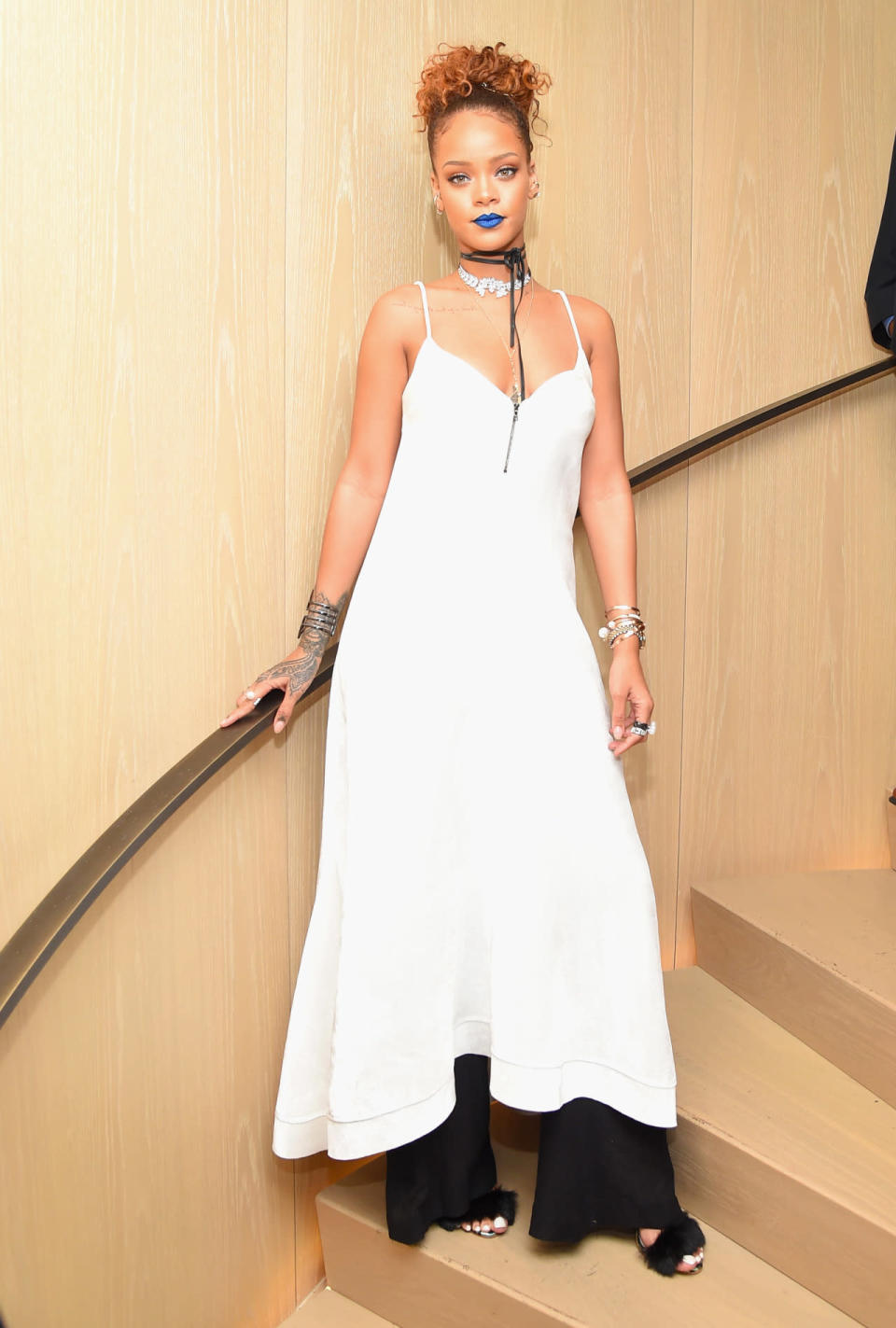 Rihanna wearing a dress with pants at her Fashion Week party on Sept. 10, 2015 in New York City.