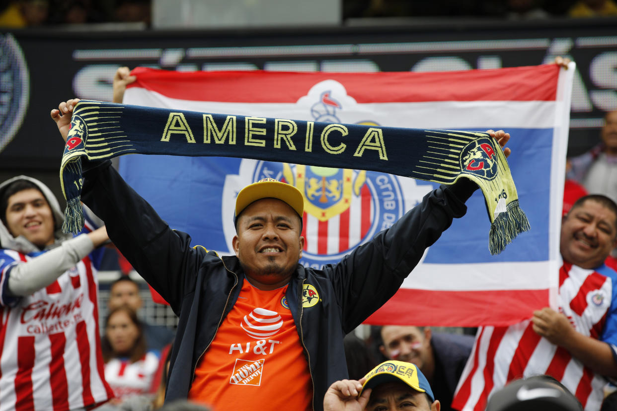 Club America and Chivas de Guadalajara fans cheer before a Super Clasico soccer match Sunday, Sept. 8, 2019, in Chicago. (AP Photo/Jim Young)