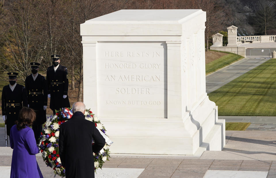 President Joe Biden and Vice President Kamala Harris pause at the Tomb of the Unknown Soldier at the Arlington National Cemetery, in Arlington, Va., Wednesday, Jan. 21, 2021. Joshua Roberts/Pool photo via AP)