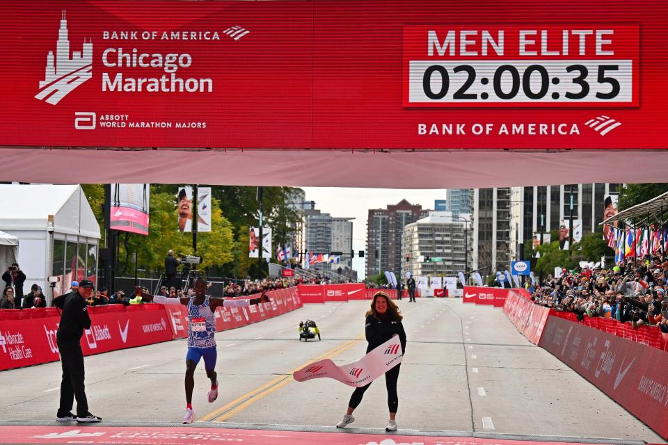 Oct 8, 2023; Chicago, IL, USA; Kelvin Kiptum of Kenya crosses the finish line of the 2023 Chicago Marathon with a new world record time of 2:00:35. Mandatory Credit: Jamie Sabau-USA TODAY Sports