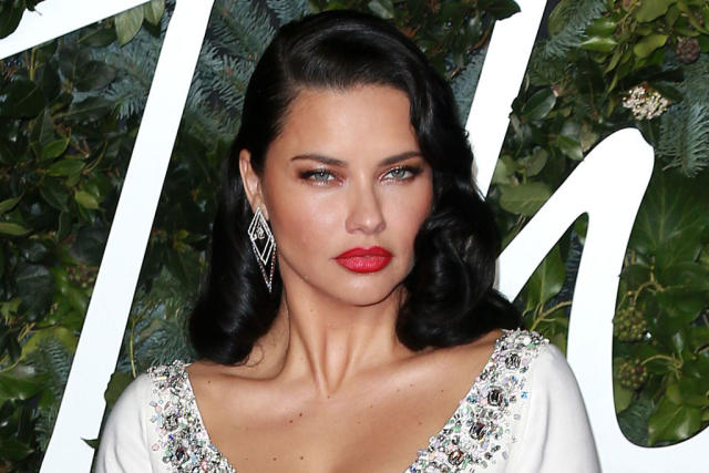 Adriana Lima Makes a Luxe Arrival in Crystal-Embellished Crop Top, Skirt &  Strappy Sandals at the Fashion Awards