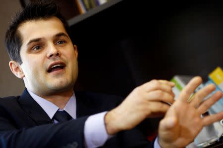 Brazilian prosecutor Rafael Brum Miron gestures during an interview with Reuters in Curitiba, Brazil, July 25, 2016. REUTERS/Rodolfo Buhrer