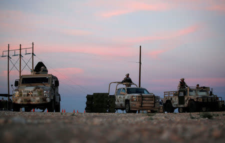 Military personnel keep watch at a checkpoint on the perimeter of a high security prison where drug lord Joaquin "El Chapo" Guzman is imprisoned in Ciudad Juarez, Mexico May 11, 2016. REUTERS/Jose Luis Gonzalez