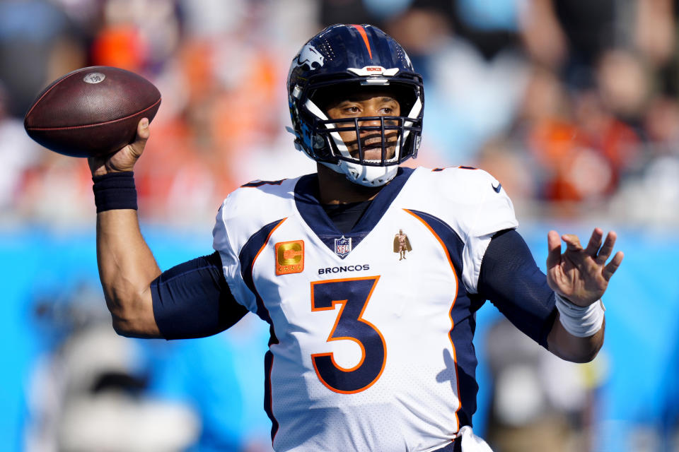 Denver Broncos quarterback Russell Wilson passes during the first half of an NFL football game between the Carolina Panthers and the Denver Broncos on Sunday, Nov. 27, 2022, in Charlotte, N.C. (AP Photo/Jacob Kupferman)
