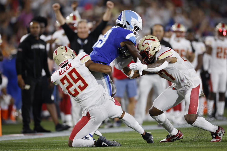 BIRMINGHAM, AL - APRIL 30: Birmingham Stallions cornerback Brian Allen (29) and safety JoJo Tillery (27) combine to tackle New Orleans Breakers wide receiver Taywan Taylor (13) during the USFL game on April 30, 2022 at Protective Stadium in Birmingham, Alabama. (Photo by Joe Robbins/Icon Sportswire via Getty Images)