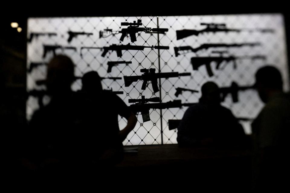 AR-15 rifles are displayed at an exhibition booth during the National Rifle Association (NRA) annual convention in Dallas, Texas, U.S., May 18, 2024. Picture taken with a tilt-shift lens.