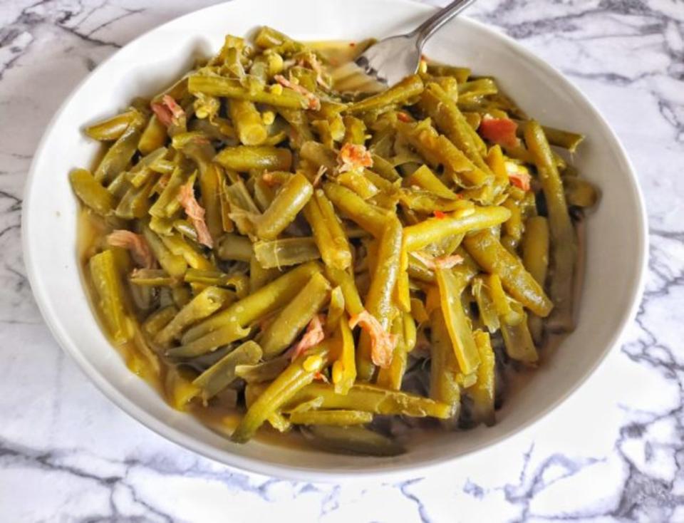 <p>The Skinni Food Whore</p><p>Slow-cooked string beans are the perfect side dish for any protein. The smoked turkey makes a flavorful broth for this southern-style side dish.</p><p><strong>Get the recipe: <a href="https://theskinnifoodwhore.com/slow-cooked-string-beans-with-smoked-turkey/" rel="nofollow noopener" target="_blank" data-ylk="slk:Slow-Cooked String Beans with Smoked Turkey;elm:context_link;itc:0;sec:content-canvas" class="link ">Slow-Cooked String Beans with Smoked Turkey</a></strong></p>