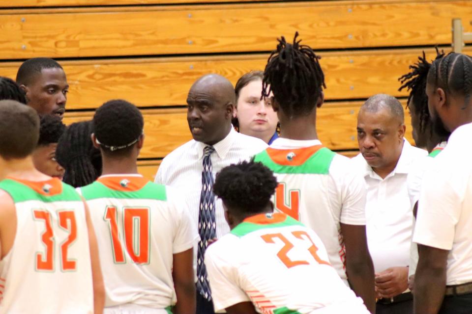 Atlantic coach Tony Watson talks to players during a timeout of the Eagles’ season opener against Royal Palm Beach at Atlantic High on November 22, 2023.