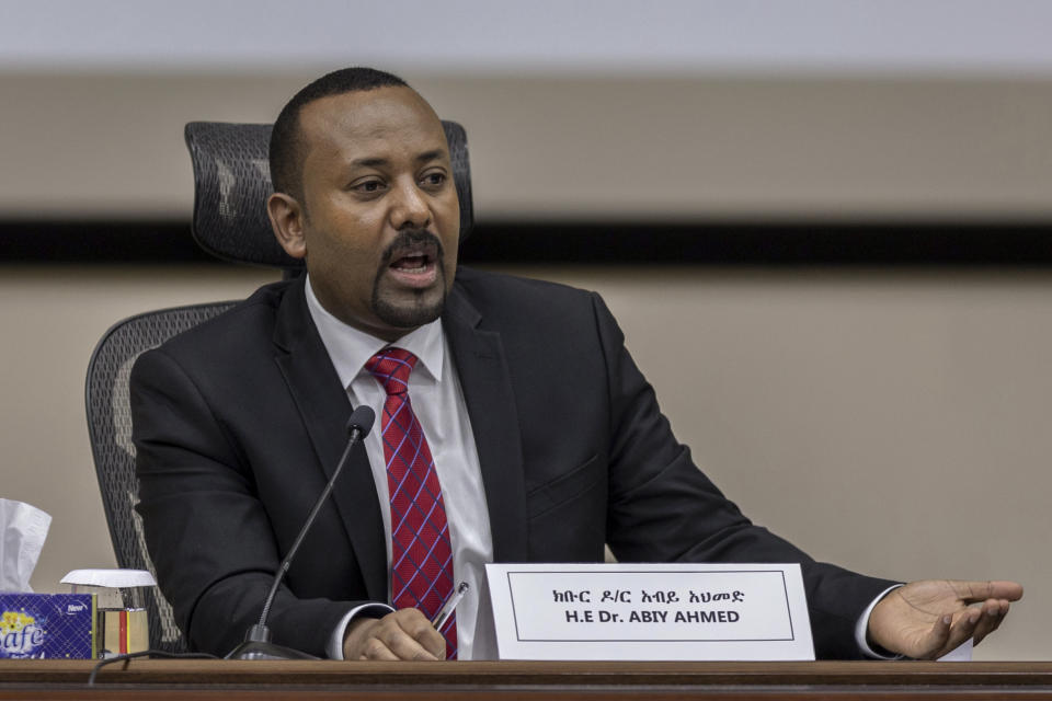 Ethiopia's Prime Minister Abiy Ahmed responds to questions from members of parliament at the prime minister's office in the capital Addis Ababa, Ethiopia Monday, Nov. 30, 2020. The fugitive leader of Ethiopia's defiant Tigray region on Monday called on Prime Minister Abiy Ahmed to withdraw troops from the region as he asserted that fighting continues "on every front" two days after Abiy declared victory. (AP Photo/Mulugeta Ayene)