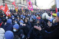 Protesters march during a demonstration against French presidential candidate Eric Zemmour, Sunday, Dec. 5, 2021 in Paris. French far right presidential candidate Eric Zemmour holds his first campaign rally in Villepinte, north of Paris. A first round is to be held on April, 10, 2022 and should no candidate win a majority of the vote in the first round, a runoff will be held between the top two candidates on April 24, 2022. (AP Photo/Michel Spingler)