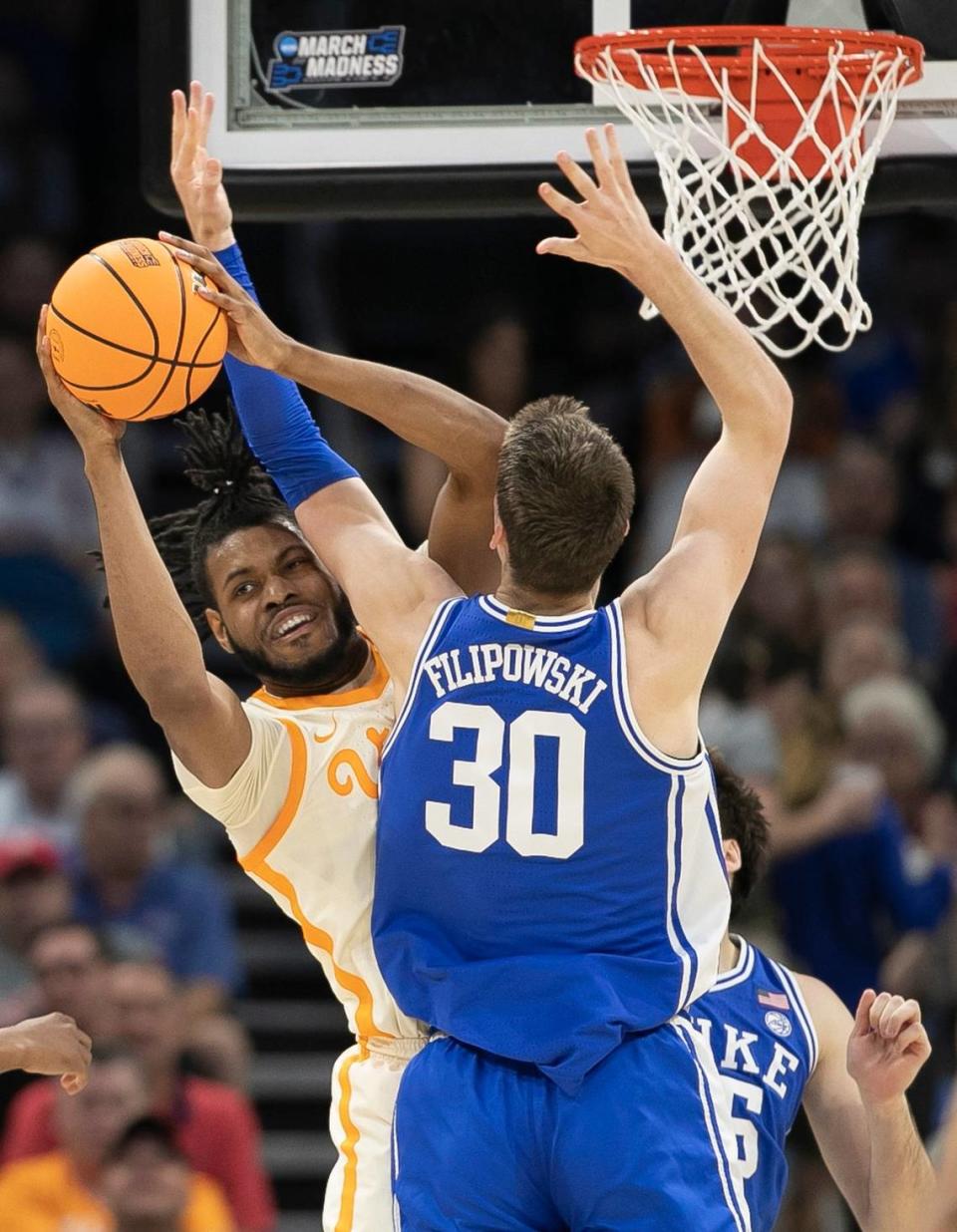 Duke’s Kyle Filipowski (30) and Tennessee’s Jonas Aidoo (0) battle for a rebound in the first half during the second round of the NCAA Tournament on Saturday, March 18, 2023 at the Amway Center in Orlando, Fla.