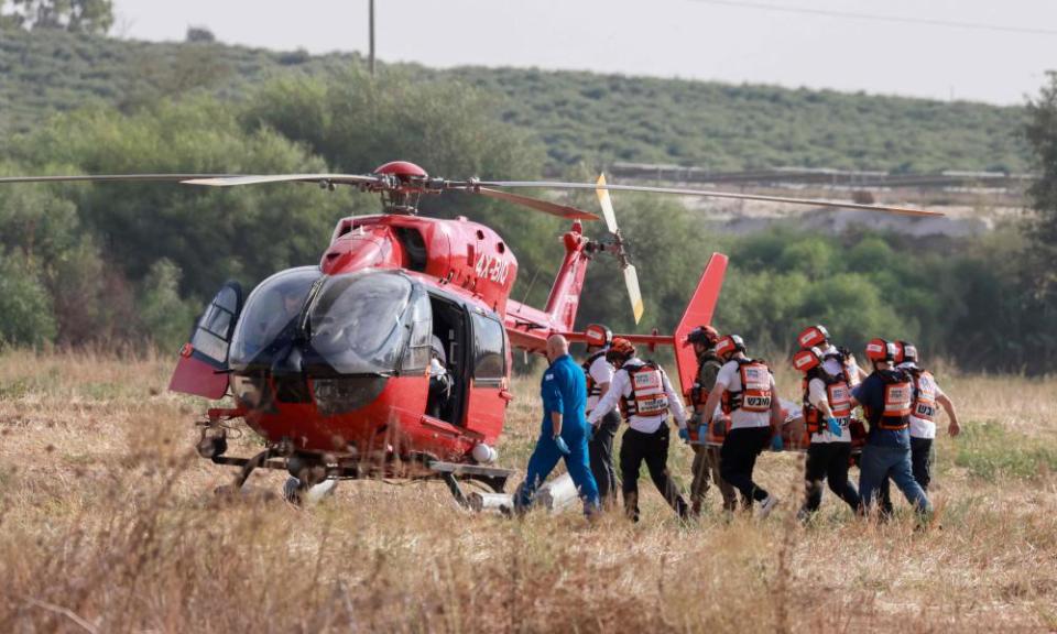 Israeli rescue teams evacuate wounded people by helicopter near Sderot