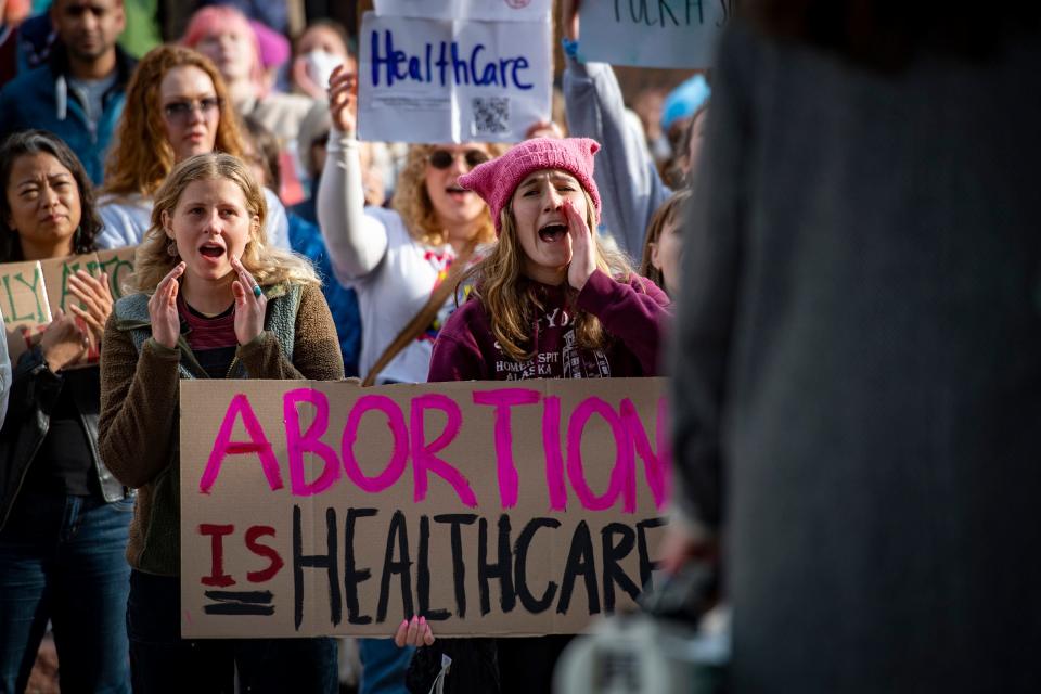Protestors cheer on a speaker during an abortion and reproductive rights rally at Old Town Square on Tuesday.