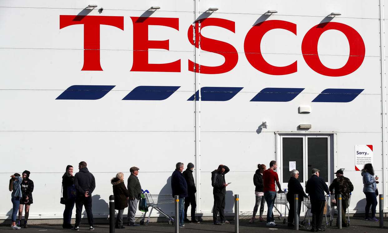 People queue outside a Tesco Extra store in Madeley, Shropshire. Tesco have announced their stores will now have a designated hour for NHS staff to shop during the coronavirus outbreak. Picture date: Sunday March 22, 2020. See PA story HEALTH Coronavirus. Photo credit should read: Nick Potts/PA Wire (Photo by Nick Potts/PA Images via Getty Images)