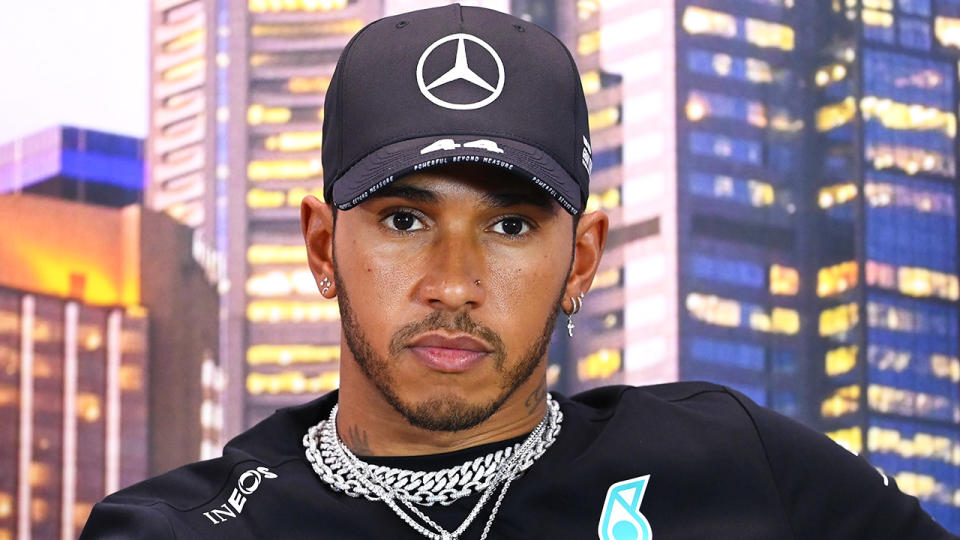 Lewis Hamilton looks forward during an interview.