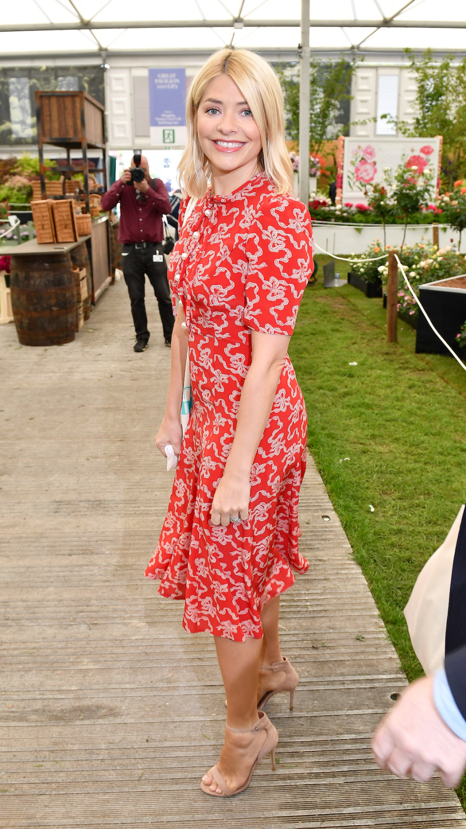 <p> Only florals will do for the Chelsea Flower Show. Willoughby dressed for the occasion in a red printed LK Bennett skater-style midi at the famous London event in 2018. She paired the striking short-sleeved frock with a pair of classic heels. </p>