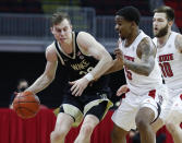 Wake Forest's Jonah Antonio (20) tries to get around North Carolina State's Thomas Allen (5) during the first half of an NCAA college basketball game Wednesday, Jan. 27, 2021, in Raleigh, N.C. (Ethan Hyman/The News & Observer via AP, Pool)