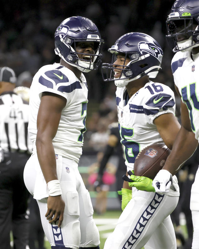 New Orleans Saints tight end Taysom Hill (7) carries for a first down  against Seattle Seahawks cornerback Tariq Woolen (27) during an NFL  football game in New Orleans, Sunday, Oct. 9, 2022.