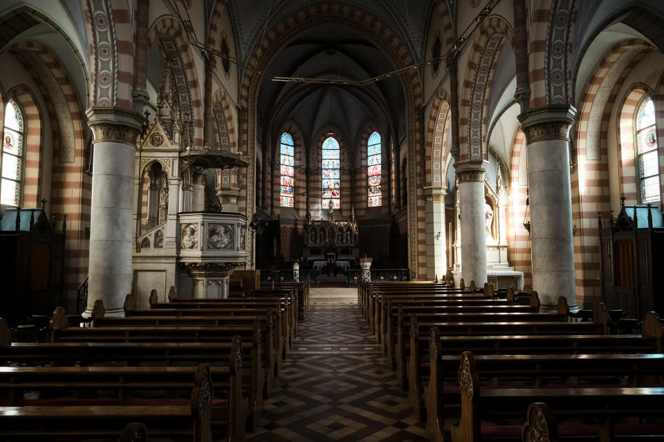 In this Thursday, April 9, 2020 photo, the Sacred Heart Cathedral in Sarajevo, Bosnia, is deserted due to the national lockdown the authorities have imposed attempting to limit the spread of the new coronavirus. (AP Photo/Kemal Softic)