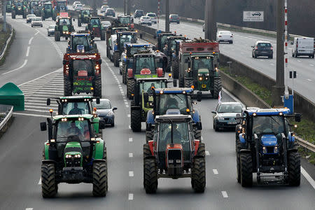 French farmers drive their tractors on the A7 highway to protest changes in underprivileged farm area’s mapping and against Mercosur talks, in Solaize near Lyon, France, February 21, 2018. REUTERS/Emmanuel Foudrot