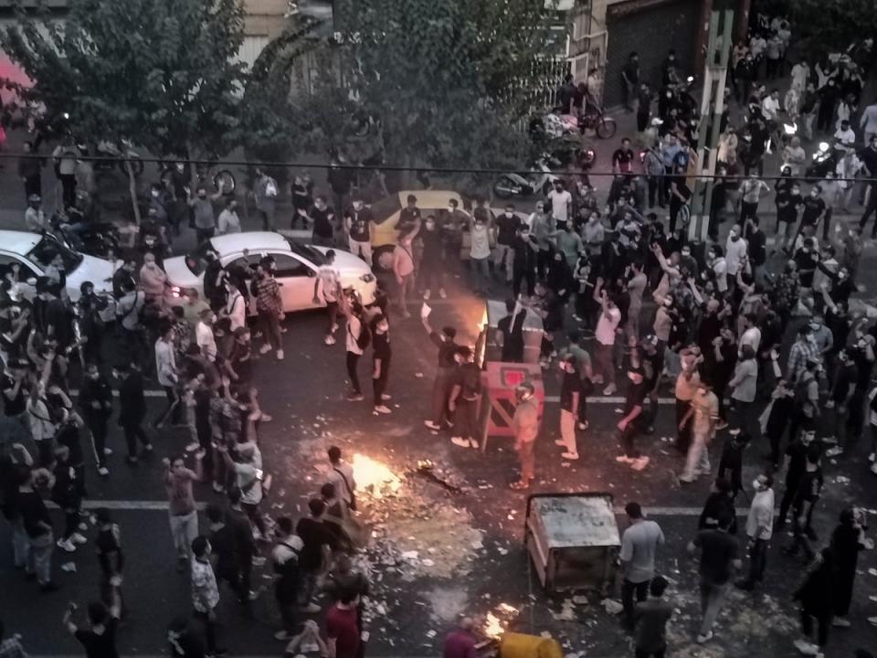 Iranians protest 22-year-old Mahsa Amini's death after she was detained by the morality police in Tehran (Copyright 2022 The Associated Press. All rights reserved.)