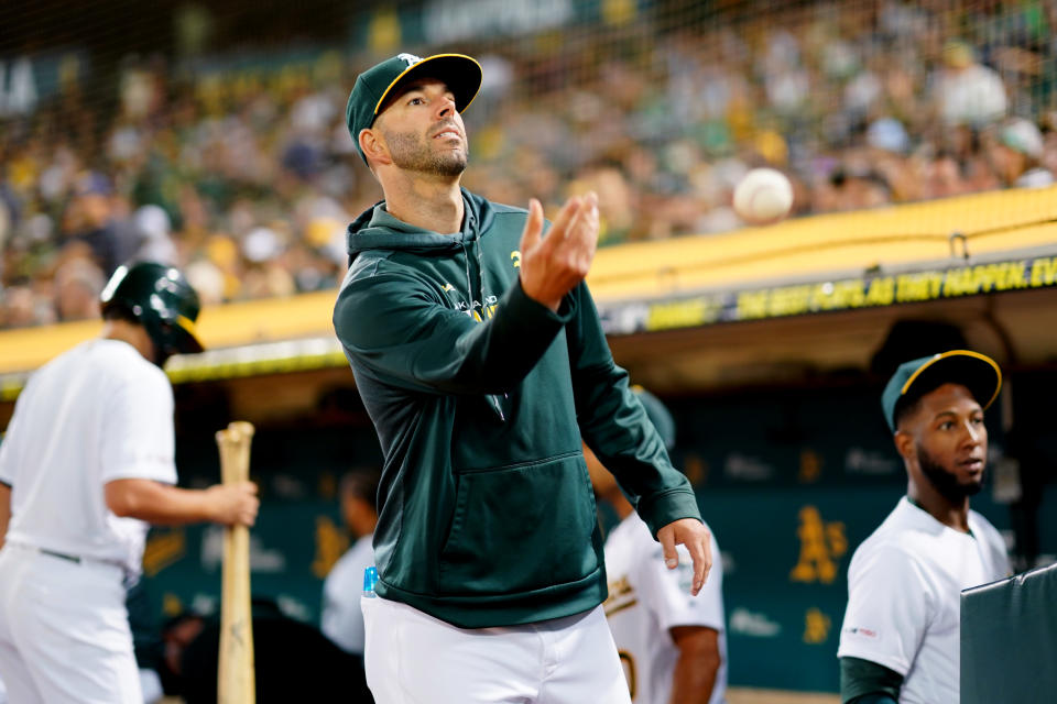 OAKLAND, CA - SEPTEMBER 21:  Mike Fiers #50 of the Oakland Athletics tosses a baseball in front of the dugout during the game between the Texas Rangers and the Oakland Athletics at Oakland Coliseum on Saturday, September 21, 2019 in Oakland, California. (Photo by Daniel Shirey/MLB Photos via Getty Images)