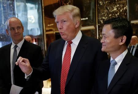 U.S. President-elect Donald Trump and Alibaba Executive Chairman Jack Ma speak with members of the news media after their meeting at Trump Tower in New York, U.S., January 9, 2017. REUTERS/Mike Segar