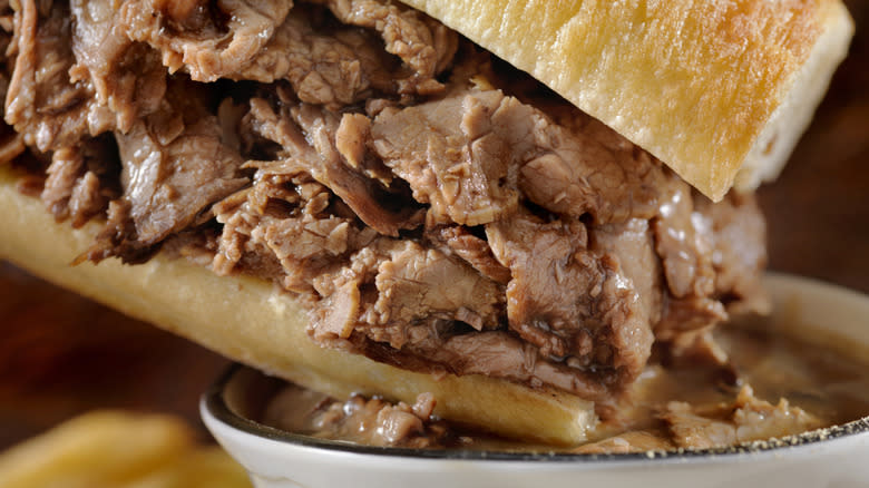 Dunking French dip sandwich