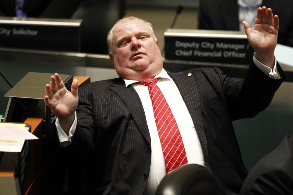 Toronto Mayor Rob Ford reacts during a special council meeting at City Hall in Toronto