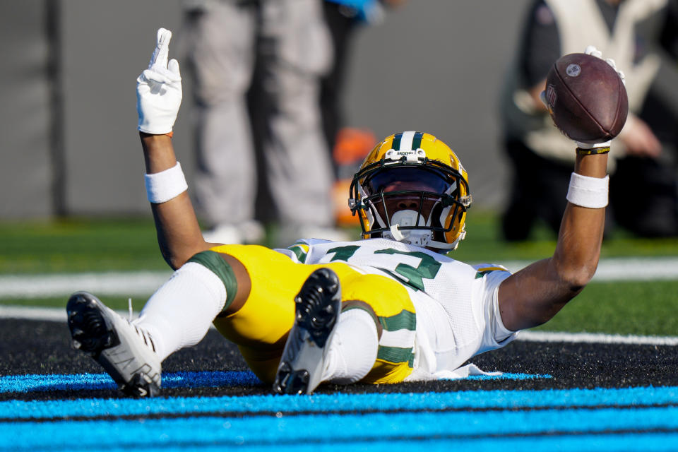 Green Bay Packers wide receiver Dontayvion Wicks celebrates after scoring against the Carolina Panthers during the first half of an NFL football game Sunday, Dec. 24, 2023, in Charlotte, N.C. (AP Photo/Jacob Kupferman)