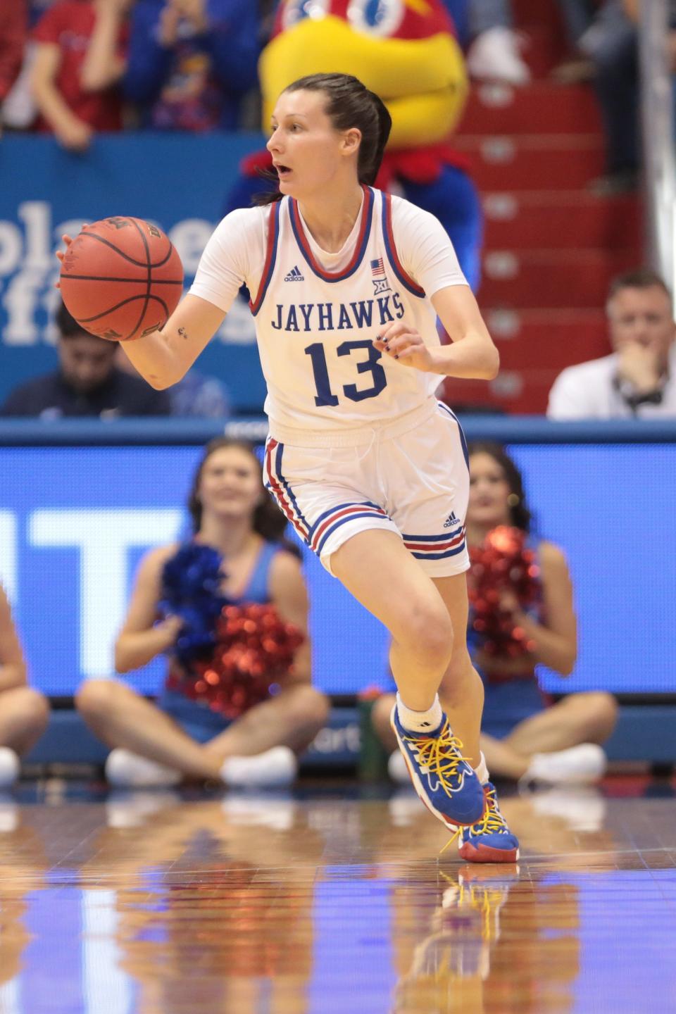 Kansas guard Holly Kersgieter (13) dribbles down the court during the Jayhawk's WNIT championship victory this past season against Columbia inside Allen Fieldhouse.