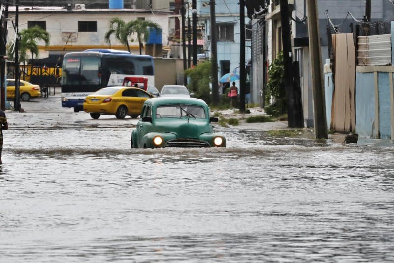 A flooded street in Havana, Cuba on Tuesday inundates vehicles after Tropical Storm Idalia blew through. The Institute of Meteorology (Insmet) reported winds of up to 82 mph with widespread power outages as Hurricane Idalia took aim at Florida. Photo by Ernesto Mastracusa/EPA-EFE