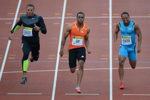 L-R: US athlete Ryan Bailey, US athlete Tyson Gay and Jamaica's Michael Frater compete in the men's 100m final at the 2012 Diamond League athletics meet at Crystal Palace in London. Gay shrugged off damp and cold conditions to power to victory in the 100m at the London Diamond League meeting