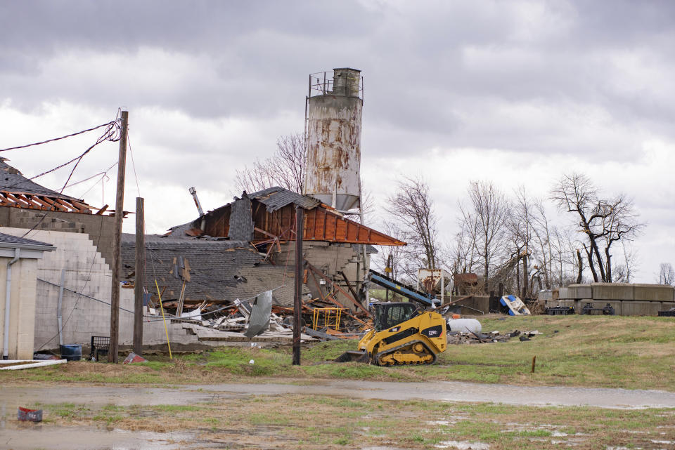 This Thursday, March 14, 2019 photo shows damage to the Wilbert Vault Co., in West Paducah, Ky. A tornado left a path in western Kentucky from Lovelaceville through the West Paducah area, according to Keith Todd, a spokesman for the Kentucky Transportation Cabinet. He said the public was being asked to avoid the area while utility crews, area fire departments, and rescue squads worked to clear utility lines, downed trees and other debris. (Dave Thompson/The Paducah Sun via AP)
