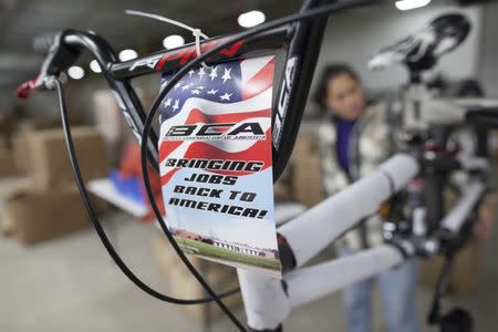 A patriotic label is affixed to the handlebars of each bike at the new Bicycle Corporation of America plant in Manning, South Carolina, November 19, 2014. The BCA plant, which is owned and operated by Kent International, started the new U.S. assembly line in October 2014. REUTERS/Randall Hill